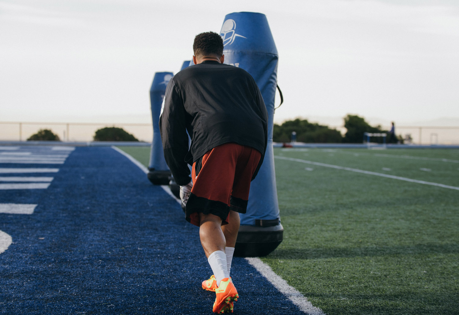 Football player engaged in on field practice